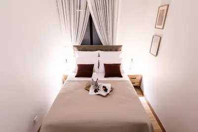 a bedroom with a large bed with flowers on it at Klimatyzowany apartament Dworzec Główny Stare Miasto in Kraków