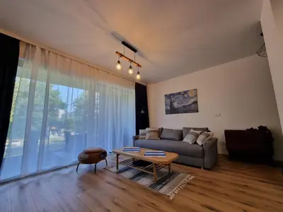 a living room with a couch and a table at Aurum Apartment in Oświęcim