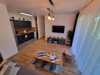 an aerial view of a living room with a table at Aurum Apartment in Oświęcim