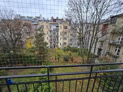 a view of a city from a balcony with buildings at Fantastic-Inn Kraków - KR63 in Kraków