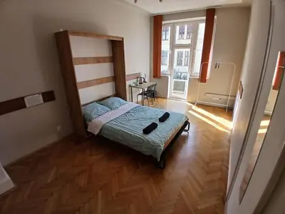 a bedroom with a bed in a room at Fantastic-Inn Kraków - KR63 in Kraków