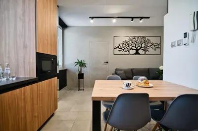 a dining room with a table and chairs at Revel Apart in Zator
