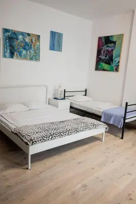 a room with two beds in a room at Funny Apartment in Kraków