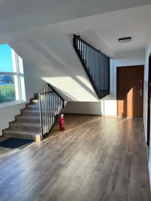 an empty room with stairs and a fire hydrant at Solny apartament
