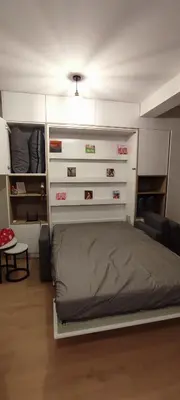a bedroom with a bed and some drawers at Wieliczka Apartment in Czarnochowice
