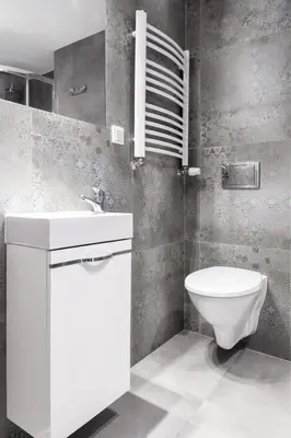 a bathroom with a white sink and a toilet at Househost Apartment Plac Wolnica 9 in Kraków