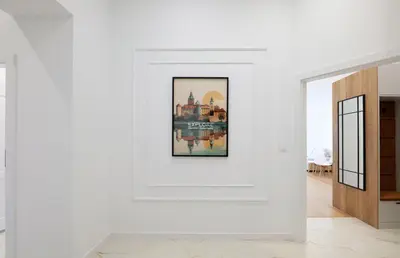 a white room with a picture on the wall at Apartamenty Złota Brama in Kraków