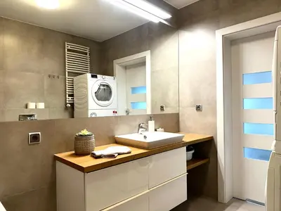 a bathroom with a sink and a microwave at Masarska Apartment - Self Check-In 20h - Parking&Lift in Kraków