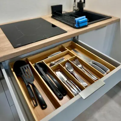 a drawer in a counter with utensils in it at Apartment Chrzanòw in Chrzanów