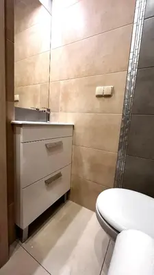 a bathroom with a sink and a toilet at Studio for One in Kraków