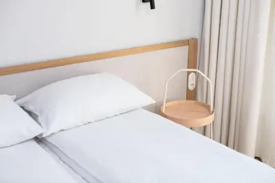 a bedroom with two white beds and a mirror at City of the Kings-Riverside K22M31 in Kraków