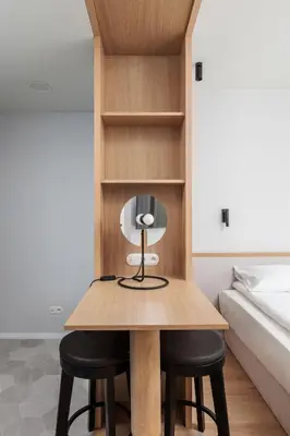 a room with a table and two chairs next to a bed at City of the Kings-Riverside K22M31 in Kraków