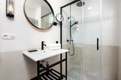 a bathroom with a sink and a shower at City of the Kings-Riverside K22M16 in Kraków