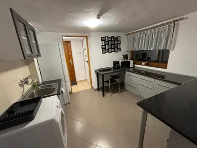 a kitchen with a sink and a counter at Nad potokiem in Nowy Targ