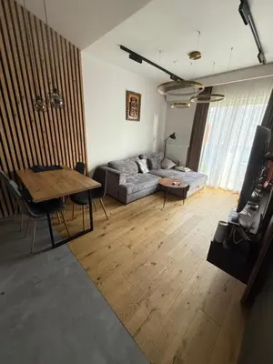 a living room with a couch and a table at Zablocie Apartment near to Schindler Fabric - 48m2 in Kraków