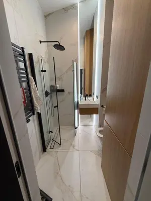 a bathroom with a shower and a sink at Zablocie Apartment near to Schindler Fabric - 48m2 in Kraków