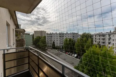 a balcony with a view of a street and buildings at Grzegórzki Chic Studio by BookingHost in Kraków