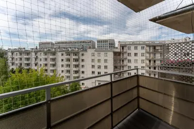 a balcony with a view of a building at Grzegórzki Chic Studio by BookingHost in Kraków