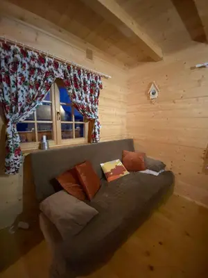 a wooden ceiling with a view of a mountain at Hope Mountain Escape Poland, Wooden Cabin in Szczawa