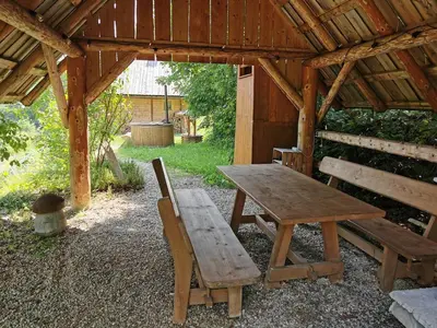 a small wooden sauna and a wooden barrel at Hope Mountain Escape Poland, Wooden Cabin in Szczawa