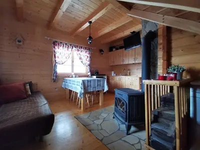 a mountain covered in snow with a wooden fence at Hope Mountain Escape Poland, Wooden Cabin in Szczawa