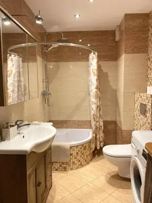 a bathroom with a sink and a tub and a toilet at Green Garden Oasis in Kraków