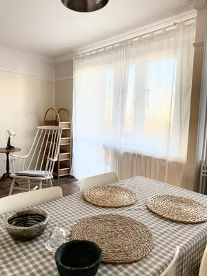 a dining room table with three baskets on top of it at Comfortable and large apartment in Kraków