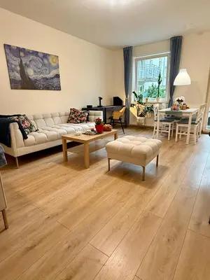 a living room with a couch and a table at Kraków Nest in Kraków