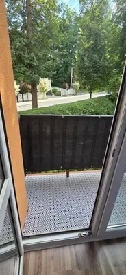 a view from an open door of a patio at W Rabczańskiej Dolinie in Rabka