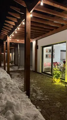 a building with snow on the floor and a room with a bed at Fundacja Dom Pracy Twórczej PAU Zawoja in Zawoja