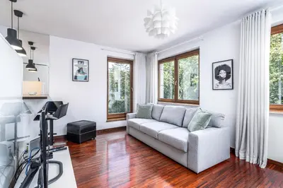 a living room with a couch and a television at RentPlanet - Apartament Kazimierza Wielkiego in Kraków