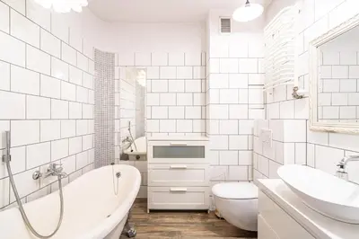 a bathroom with a tub and a toilet and a sink at RentPlanet - Apartament Kazimierza Wielkiego in Kraków