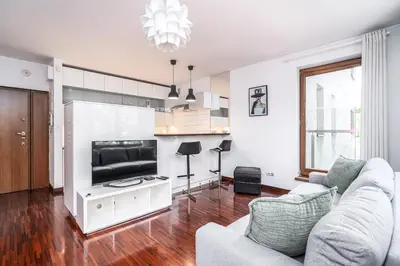 a living room with a couch and a television at RentPlanet - Apartament Kazimierza Wielkiego in Kraków