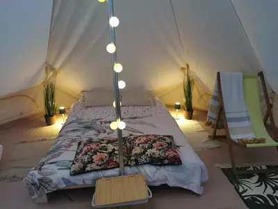 a bedroom with a bed in a tent at Hope Mountain Escape Poland, Awesome Glamping Tent in Szczawa