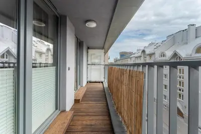 an empty balcony of a building with windows at Cricoteque Residence - Luxury 1BR Riverside Suite in Kraków
