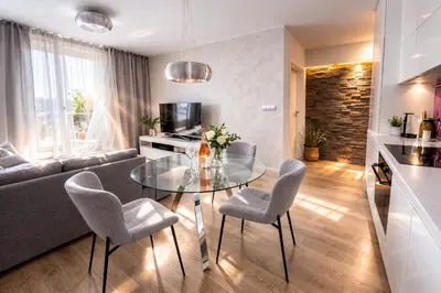 a kitchen with a sink and a purple wall at LA BELLE SUITE near Old Town & Kazimierz UNDERGROUND GARAGE INCLUDED in Kraków