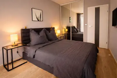 a bathroom with a tub and a toilet and a sink at LA BELLE SUITE near Old Town & Kazimierz UNDERGROUND GARAGE INCLUDED in Kraków