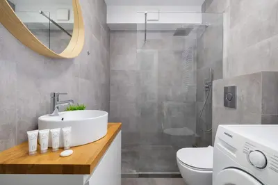 a bathroom with a sink and a toilet and a mirror at Stylish Apartment Dietla with Balcony in Kraków by Noclegi Renters in Kraków