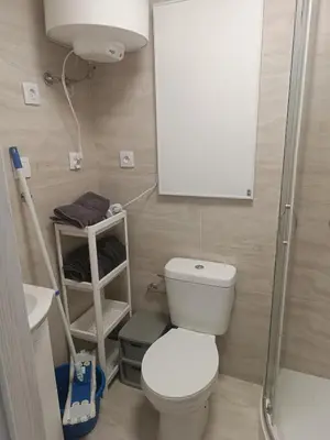 a bathroom with a white toilet and a mirror at Apartament w Kocierzu in Kocierz Rychwałdzki