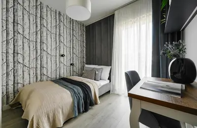 a bedroom with a bed and a desk at City Dreams Apartment in Kraków