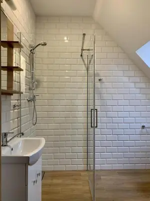 a bathroom with a glass shower and a sink at Fundacja DPT Zawoja Dom Pracy Twórczej PAU in Zawoja