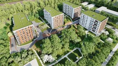 an overhead view of buildings in a park with trees at K Everhome in Kraków