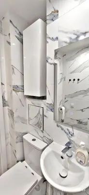 a white bathroom with a sink and a mirror at Przy Parku Wyspiańskiego in Kraków