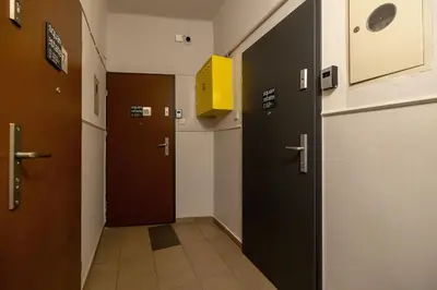 a hallway with two elevators in a building at Studio apartment - 65 Długa Street in Kraków