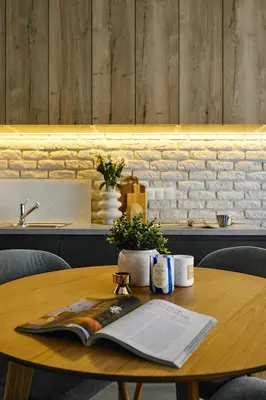 a wooden table with a book on top of it at Velvet Dreams Apartments 46 in Kraków