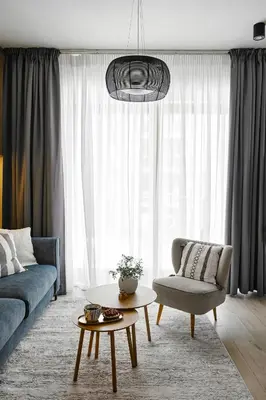 a living room with a couch and a table at Velvet Dreams Apartments 46 in Kraków