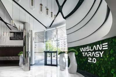a lobby with a wine therapy sign on the wall at Apartament Deluxe Wiślane Tarasy 2 I Parking in Kraków