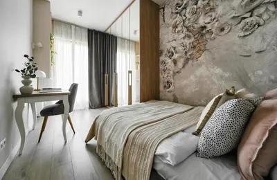 a bedroom with a bed and a desk and a wall at Velvet Dreams Apartments 49 in Kraków