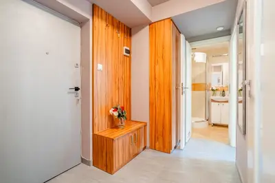 a small kitchen with a sink and a window at Krakow Cozy Nest Free Parking - By Hosty in Kraków