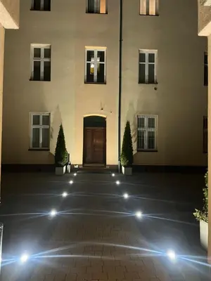a hallway with a staircase and a stair case at Topolova Apartament - Stare Miasto, 10 min od Rynku in Kraków